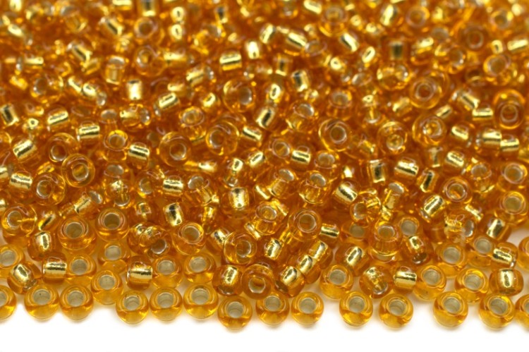 Бисер японский MIYUKI круглый 11/0 #0004 темное золото, серебряная линия внутри, 10 грамм Бисер японский MIYUKI круглый 11/0 #0004 темное золото, серебряная линия внутри, 10 грамм