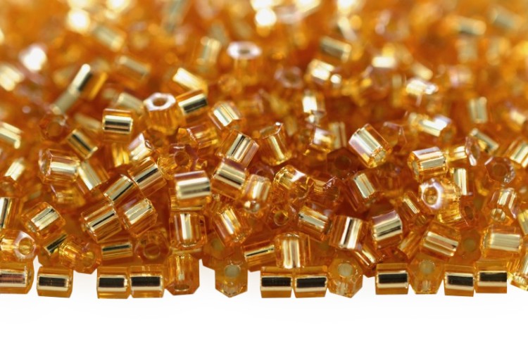 Бисер японский TOHO Hexagon шестиугольный 11/0 #0022C топаз, серебряная линия внутри, 5 грамм Бисер японский TOHO Hexagon шестиугольный 11/0 #0022C топаз, серебряная линия внутри, 5 грамм