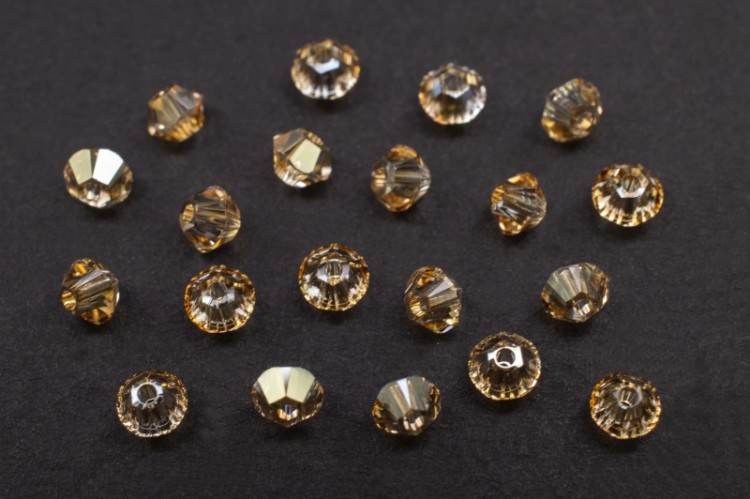 Бусина биконус Swarovski 5328 #001 GSHA 3мм Golden Shadow, 5328-3-001-205, 20шт Бусина биконус Swarovski 5328 #001 GSHA 3мм Golden Shadow, 5328-3-001-205, 20шт