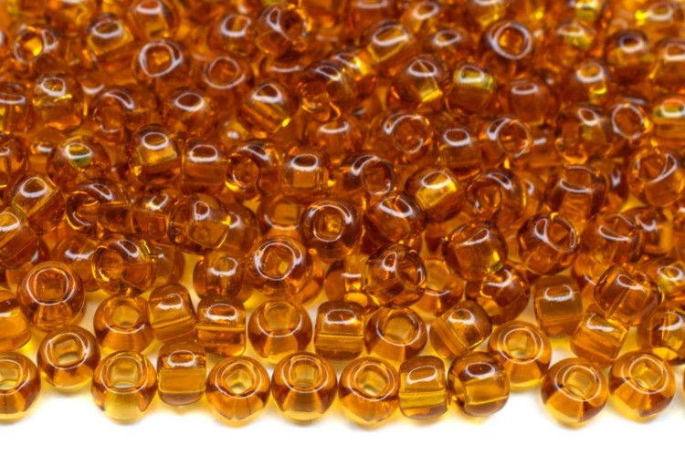 Бисер чешский PRECIOSA круглый 6/0 10070 янтарный прозрачный, квадратное отверстие, 50г Бисер чешский PRECIOSA круглый 6/0 10070 янтарный прозрачный, квадратное отверстие, 50г