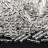 Бисер японский TOHO Bugle Twisted стеклярус витой 9мм #0021 хрусталь, серебряная линия внутри, 5 грамм - Бисер японский TOHO Bugle Twisted стеклярус витой 9мм #0021 хрусталь, серебряная линия внутри, 5 грамм