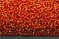 Бисер японский TOHO круглый 15/0 #0025 светлый сиамский рубин, серебряная линия внутри, 10 грамм