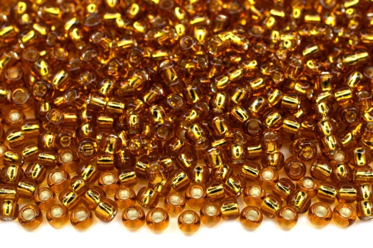 Бисер японский TOHO круглый 11/0 #0022C топаз, серебряная линия внутри, 10 грамм Бисер японский TOHO круглый 11/0 #0022C топаз, серебряная линия внутри, 10 грамм